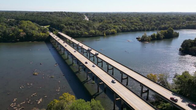 J R Allen Bridge US 80 crosses Chattahoochee River linking Columbus Georgia and Phenix City Alabama along Fall Line Freeway future I14 corridor marking Piedmont to Coastal Plain transition static shot