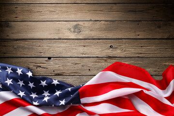 Obraz premium The American flag rests on wooden boards for a celebration