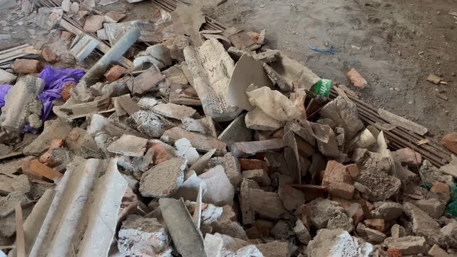 Pile of construction debris and broken bricks on demolition site