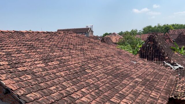 Traditional clay roof tiles of crowded residential area stock footage