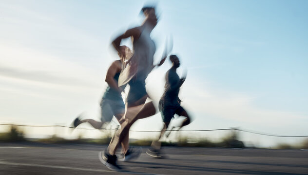 Running, motion blur and race with friends outdoor for workout partner, health or exercise with speed. Wellness. training and runner group with people in nature for sports, support and competition