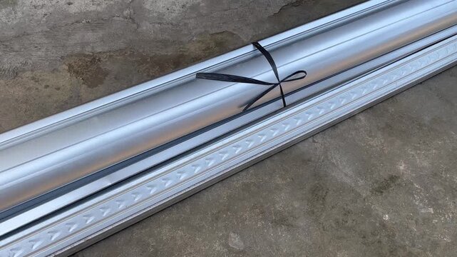 Wide angle view of bundled galvanized steel metal profiles
