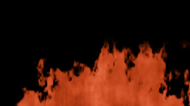 fire erupts upward in vivid orange flames against a black backdrop creating intense heat visuals. 4k HQ ProRes