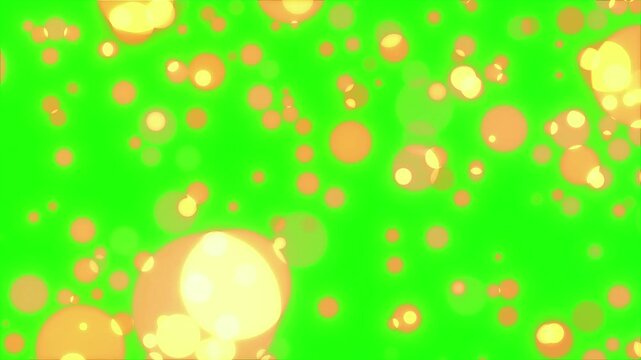 Orange bubbles floating on green liquid surface with light reflections