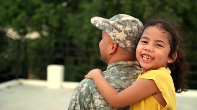 Happy daughter hugging American soldier father returning home after war. Emotional family reunion, peace, freedom, military service and joyful post war homecoming concept.
