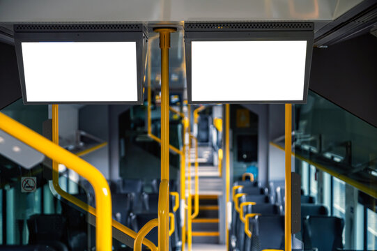 Mockup design for empty bus interior with blank panels for display or advertising