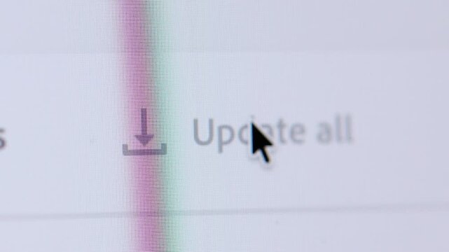 Macro shot of "Update All" text being highlighted and clicked, representing a bulk action or batch processing in a software environment.