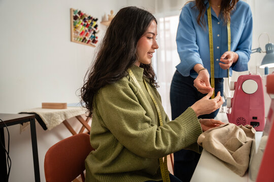 Woman working with fabric at a fashion atelier studio