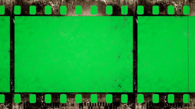 Grunge Old negative film strip on green screen chroma key background. damaged vintage reel style stock footage for cinematic video editing and creative media projects. effect production masterpieces.