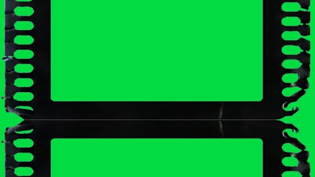 Black Rough Mask negative film strip on green screen chroma key background. dark grunge border style stock footage for cinematic video editing and creative media projects. media animation resolution