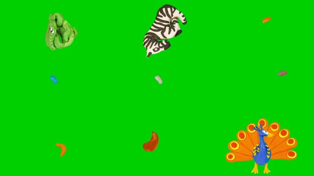 Animal clay animation on green screen chroma key background featuring zebra, fox, owl, swan, dogs. High quality isolated footage assets for your creative projects today. Use this