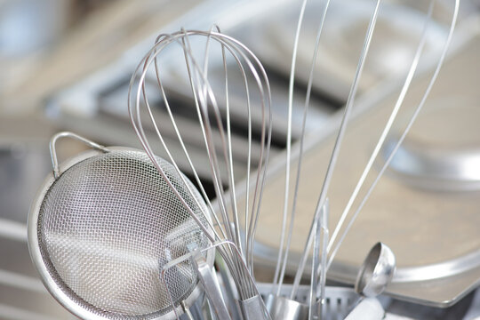 Professional Stainless Steel Kitchen Utensils and Equipment in Restaurant Scullery