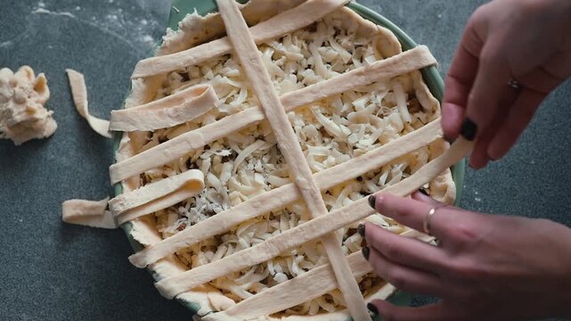A hands-on approach to creating a pie with a lattice crust is shown in each frame. The scene focuses on the process of arranging the dough on top of the filling, highlighting skillful hand movement
