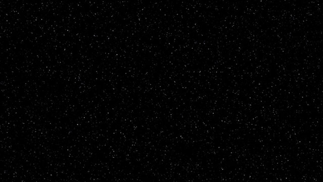 black background with scattered white dots texture. cosmic star field background with tiny white dots. 