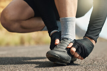 Naklejka premium Hands, athlete and person with laces outdoor to secure shoes, preparation and fitness exercise. Runner, footwear and lacing system for proper fitting, getting ready and cardio training for wellness