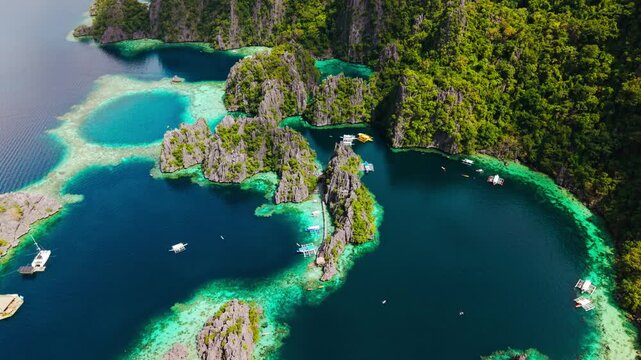 Forward flying aerial shot over Twin Lagoon in Coron Palawan Philippines