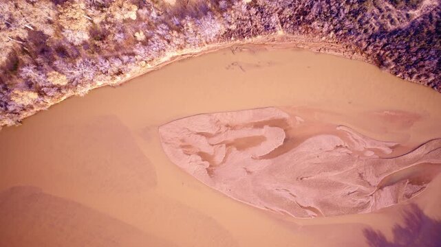 Drone capture of rugged red rock terrain under open skies