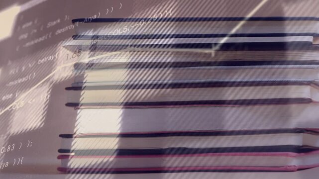 Active screen projecting diagonal graph lines and code across stack of notebooks, visualizing data