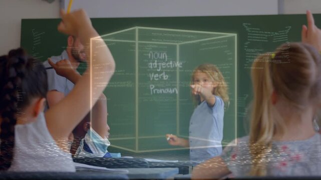 Teacher gesturing in class, activating AR cube over chalkboard showing grammar terms