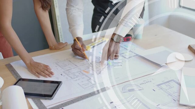 Designers leaning over plans woman pointing starting man marking pencil for signoff HUD sweeping