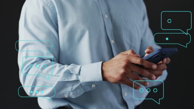 Adult man tapping phone as incoming teal chat bubbles prompt reaching to select message for tech