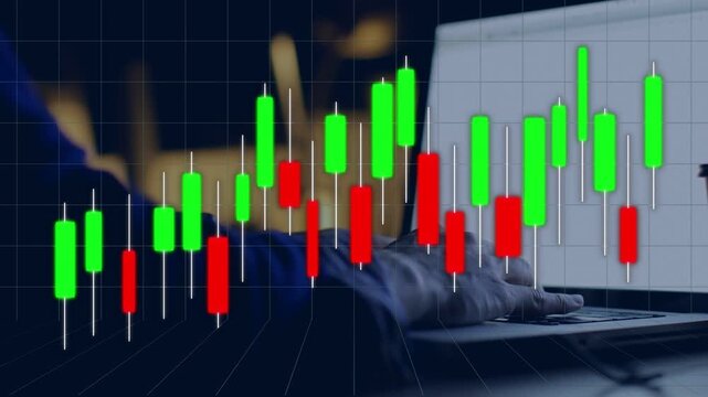 Candlestick chart moving over laptop as hand tapping keys causing candles rising showing uptrend