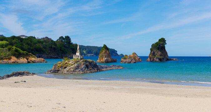 seaside monument on rocks at Covas beach in Viveiro, Lugo, with sea stacks in galicia spain