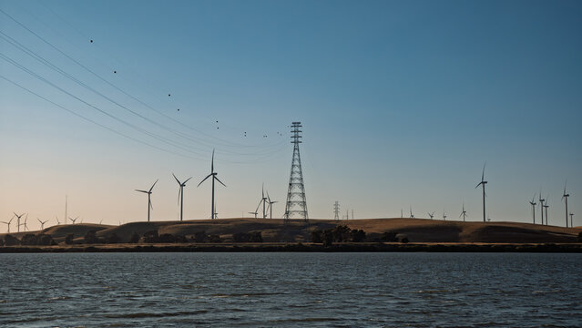 Wind Turbines and Power Lines at Dusk