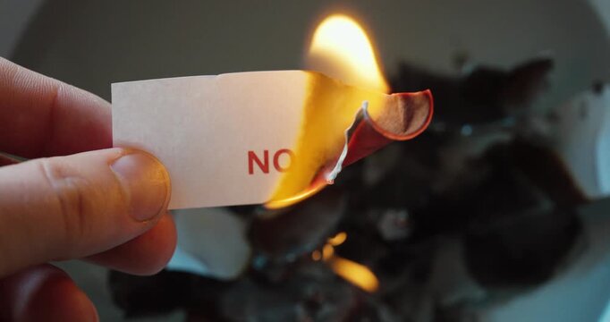 Close-up of paper labeled &ldquo;noise&rdquo; being burned, symbolizing removal of distractions and focus on clarity.