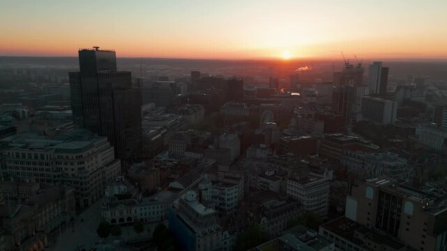 Aerial drone view of Birmingham city skyline and BT Tower at sunrise, England