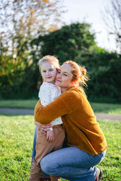 Mother and daughter looking into distance