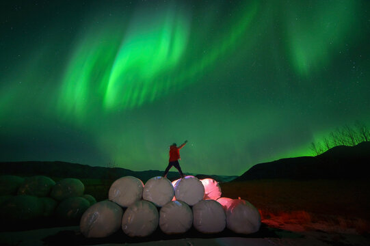 Solo female adventure traveler is discovering the ice caves in Iceland