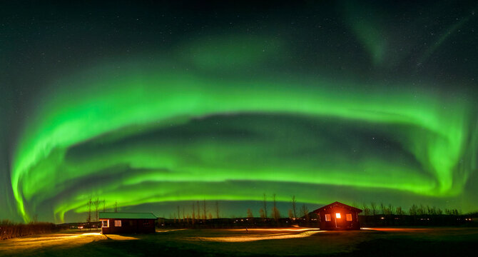 Aurora borealis over snowy mountains