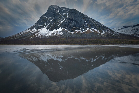 Mountain Reflection on Icy Beach at Low Tide