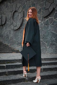 Student goes upstairs and smiles at the camera