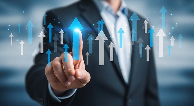Businessman pointing at rising blue arrow surrounded by white and gray arrows suit finger