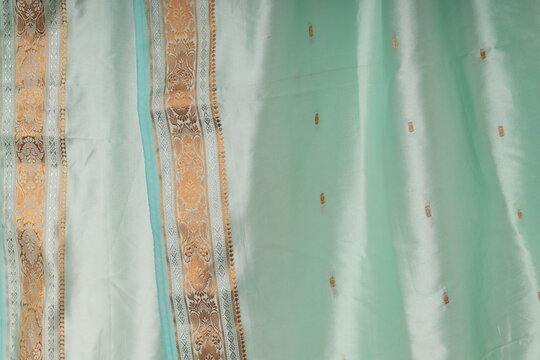 Background tiffany, turquoise, blue fabric with gold border indian sari