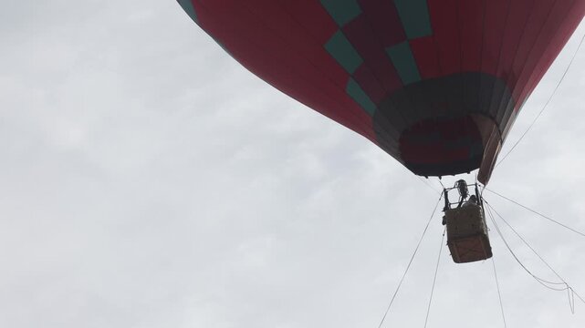Raw video footage of a colorful hot air balloon flying near Atal Tunnel in Himachal Pradesh India showcasing mountain tourism adventure and scenic landscape.