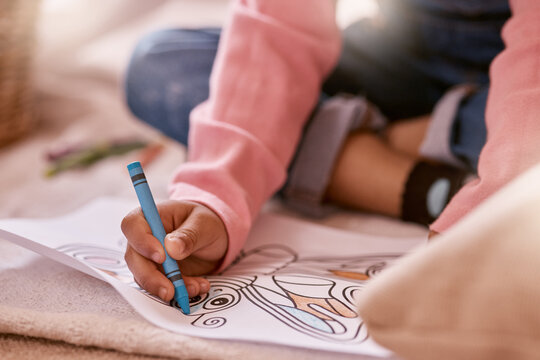 Drawing, color and hands of child with picture in home for creative learning, development and activity. House, floor and girl with crayons for art homework, design and stationery for motor skills