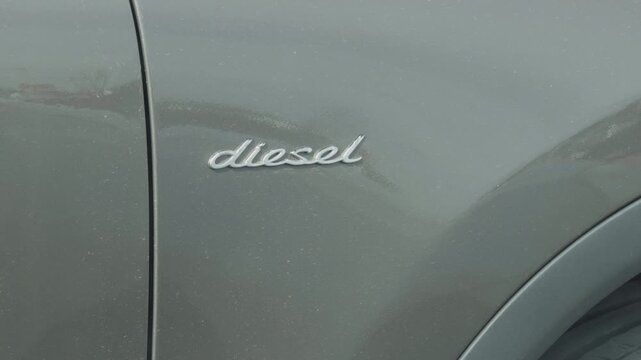 Metallic car paint with reflections. Highresolution image emphasizing vehicle branding features