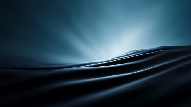 Smooth dark waves ripple under soft light, creating an abstract and serene oceanic scene with glowing highlights and deep shadows.