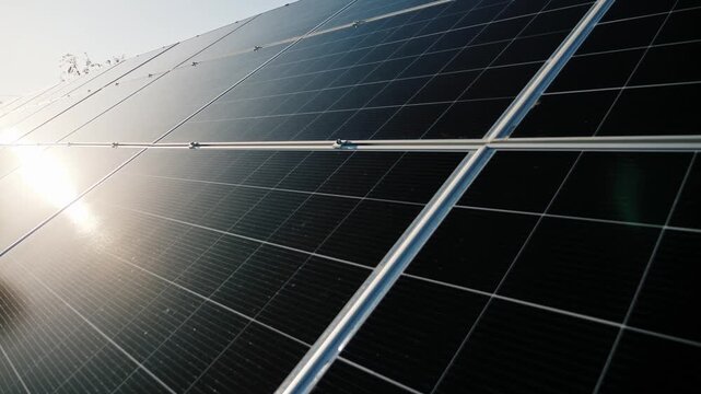 Sunlight reflecting on rows of solar panels, capturing clean energy, dynamic shot of renewable power source.