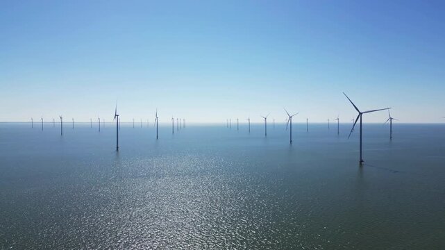 Water texture, wind turbines produce energy in the north sea, wind farm power plant view from height, green energy and alternative energy sources, windmill.