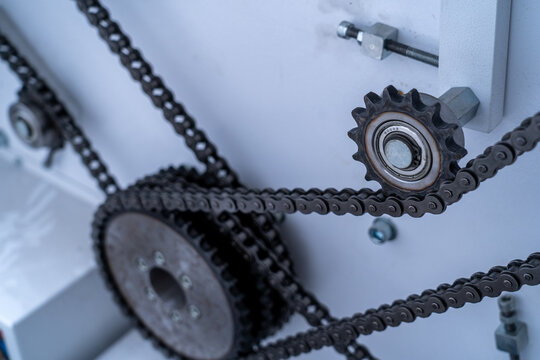 Macro of industrial chain drive and sprocket with shallow depth of field