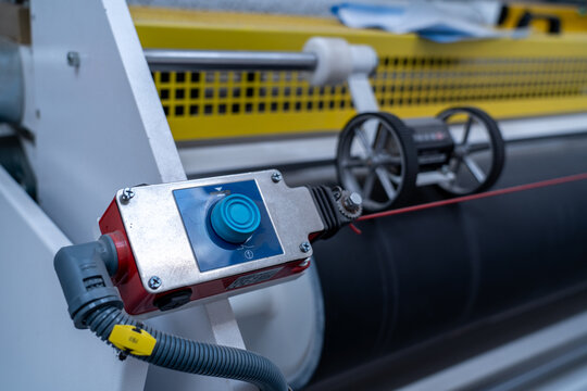 Industrial control button and rotary encoder on manufacturing machine