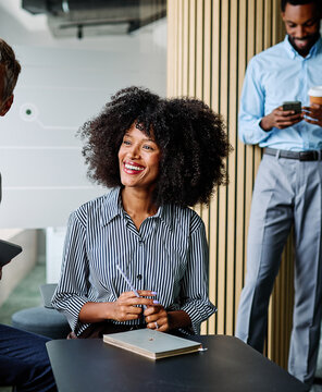 Group of young businesspeople having a meeting or presentation and seminar standing in the office. Portrait of a young businesswoman talking