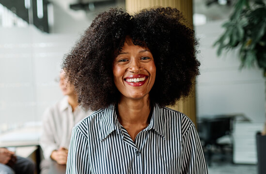 Portrait of a smart young businesswoman using a tablet computer in the office or classroom. Startup and succesful business concept or education and student concept