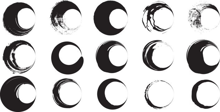 Set of hand drawn black ink brush stroke circle frames and zen ensō symbols isolated on a white background for graphic design