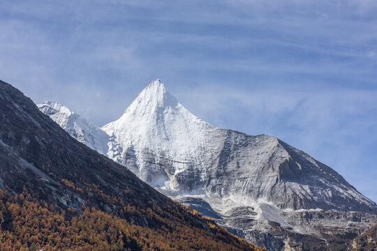 Autumn scene of Mount Jampelyang, a prominent peak in the Yading Nature Reserve located in Daocheng County, Sichuan