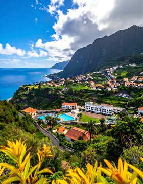 A scenic coastal town on a hillside with lush greenery